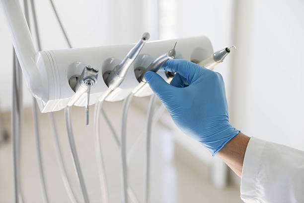 Professional Tooth Extraction technician working in Fayetteville, AL